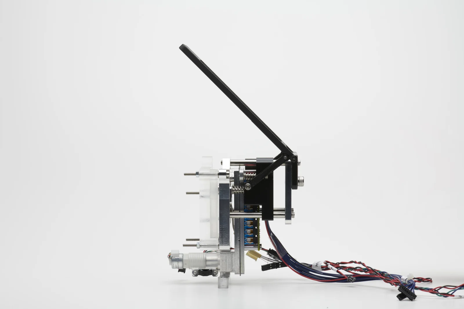 Fluidics subsystem prototype for a LAMP diagnostics device, with a lever, motor, linear hardware, and wiring.