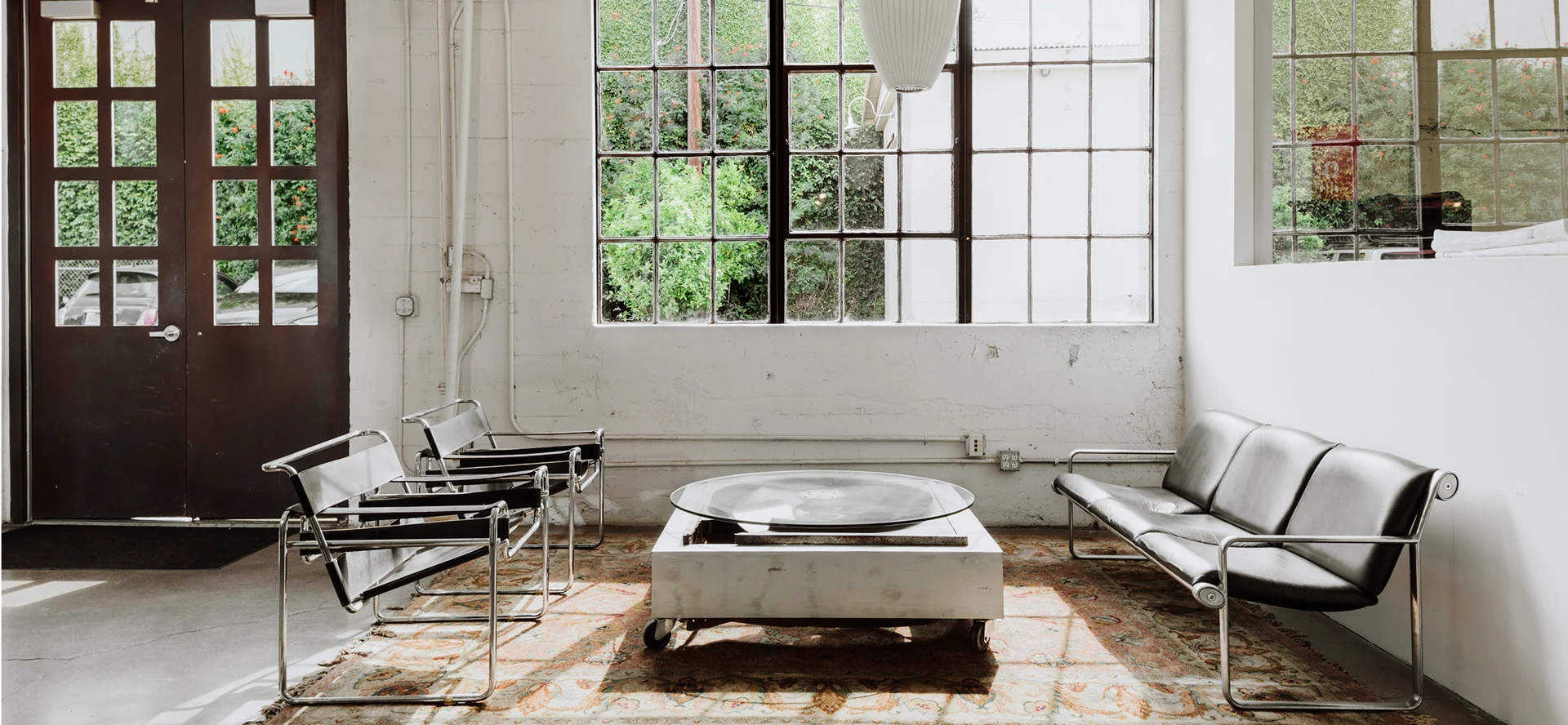 A sunlit seating area inside the IceHouse studio.